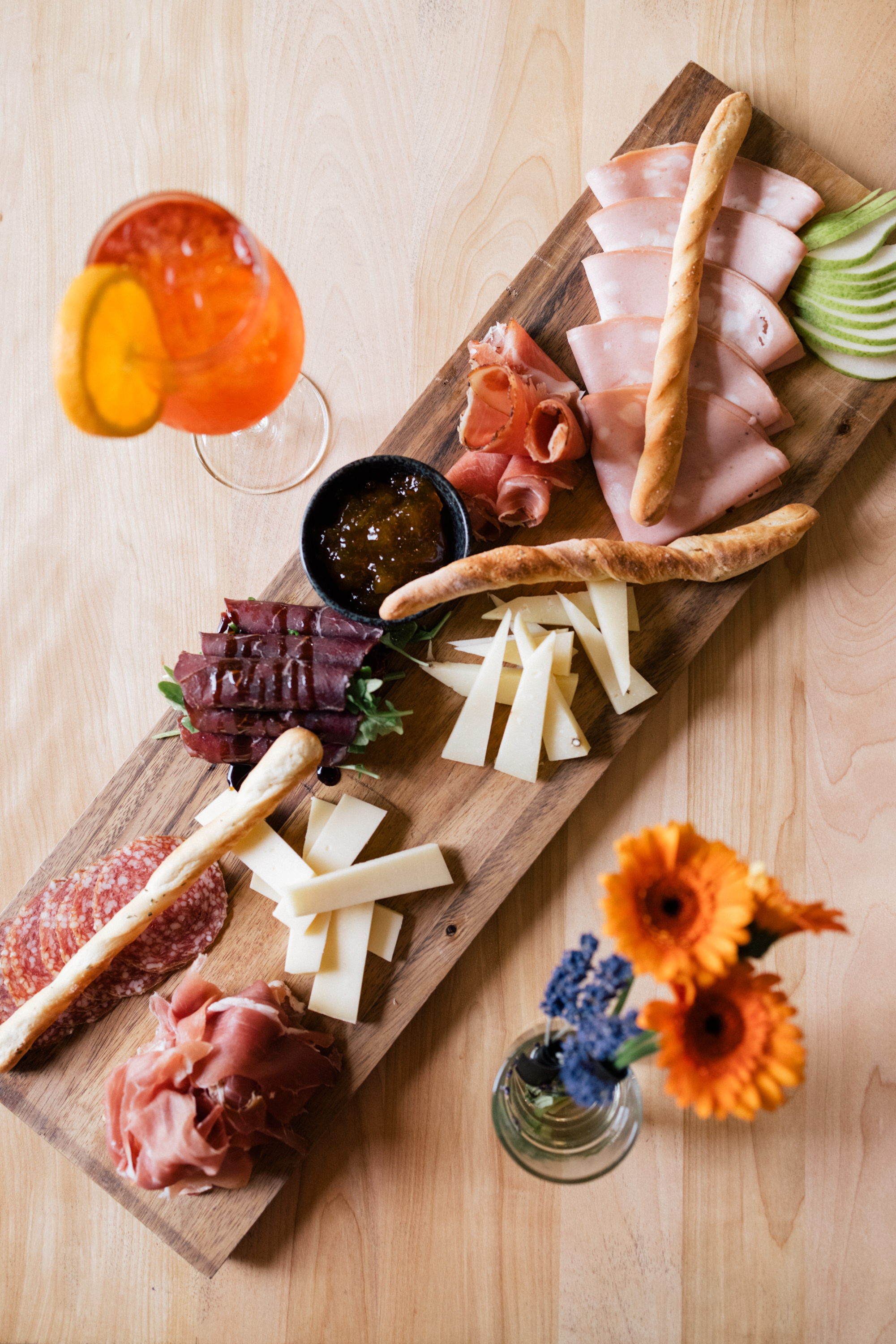 Overhead spread of Italian meats and cheese